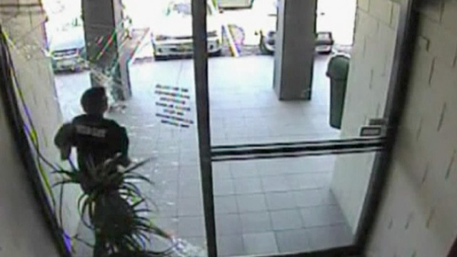 Thief slams into a glass door